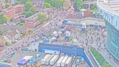 Drone descent over crowds and event activity outside Tottenham Hotspur Stadium Video stock 342735290