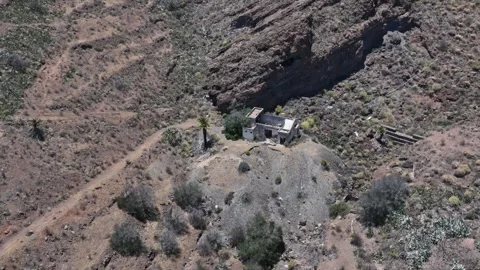Drone Descent Over Dry Terrain to Old House Ruins, Agüimes, Gran Canaria Stock Footage 310064618
