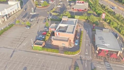 Drone descent push in toward KFC and Costa Coffee at Lakeside Village Doncaster Stock Footage 340541861