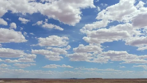 Drone Desert Cloud Timelapse Over a Rugged Southwest Horizon Featuring Remote Stock Footage 333518287