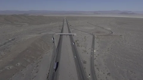 Drone Desert Day fly over highway to exit Stock Footage 81596357