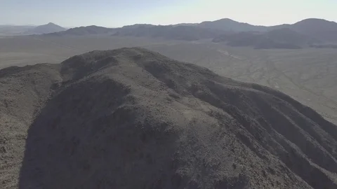 Drone Desert Day fly over mountain to reveal highway Stock Footage 81596441