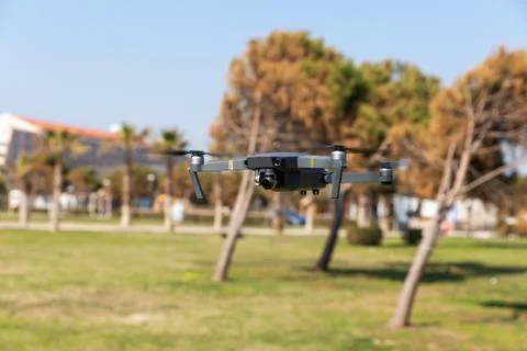 A drone with digital camera flying in the park 스톡 사진