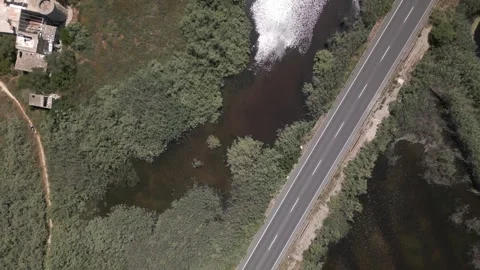 Drone Directly Overhead Road Cutting Through Wetland, Maristany, Mallorca Stock Footage 340589557