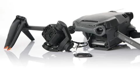 Drone DJI Mavic 3 after crashed on a white background. Drone after falling from Stock Photos