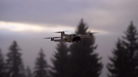 Drone DJI mini 2 stands in air with  foggy background in slow motion Video stock 168131129