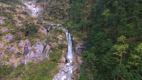 Drone documenting the raw power and beauty of falling water in North Sikkim. Stock Footage 311389196