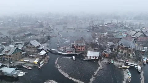 Drone documenting the raw survival effort on frozen Dal Lake. Stock Footage 311021117