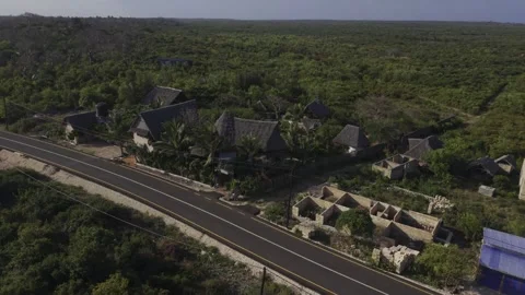 Drone does 360 in medium-wide shot of resort near Mtende Beach Stock Footage 344120305