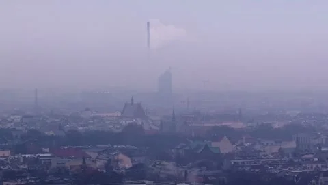 Drone Dolly Left Over Krakow Foggy Skyline with Church Spires and Chimney in Stock Footage 337043797