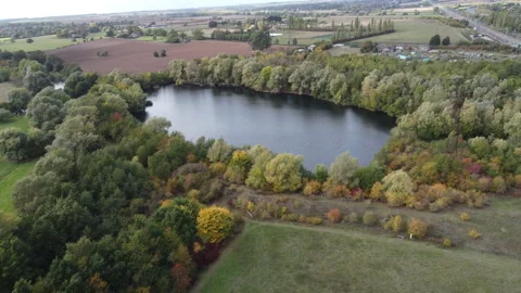 Drone Dolly Shot Lake at Bromham Nature Reserve in Bedfordshire UK Video stock 229688997