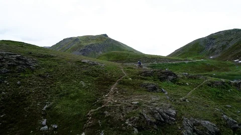 Drone of Downhill Mountain Biker Stock Footage 96052149