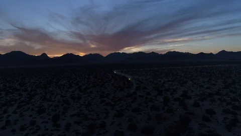 Drone dramatic backlit mountain at sunrise Stock Footage 104884097