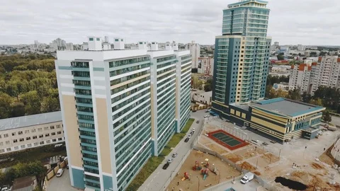 Drone drift around modern dormitory area apartment houses panel building new Stock Footage 129469610