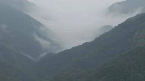 Drone Drifting through Misty Cloud Sea in Mountain Valley, Lushan Stock Footage 346700234