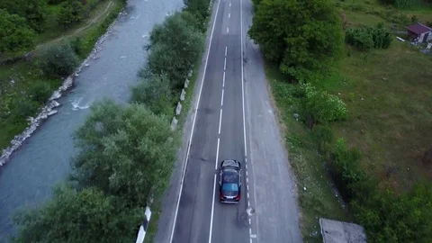 Drone driving car, Tsminda Sameba Gergeti Georgia Europe mountains cows Stock-Footage 81379903