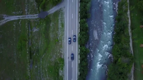Drone driving car, Tsminda Sameba Gergeti Georgia Europe mountains cows Stock Footage 81379930