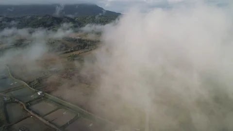 Drone dropping down and flying through amazing low level clouds in Chiang Stock Footage 100814101