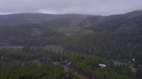 Drone Dropping Through Snowfall in Colorado Rocky Mountains Video stock 82808418