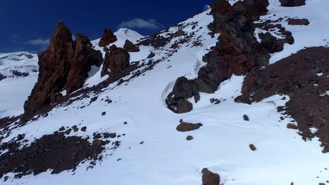 Drone Elbrus Caucasus highest peak mountain Europe Volcanic sharp cliffs glacial Stock Footage 128126889