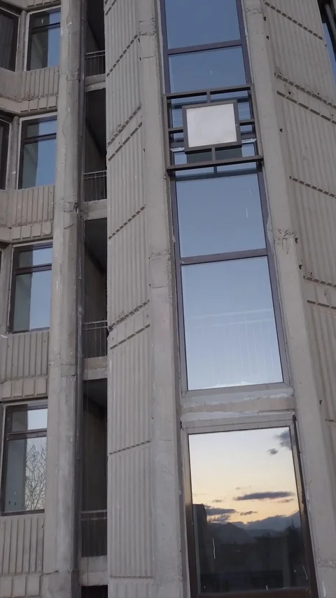 Drone elevating close to building windows Stock Footage 93838152