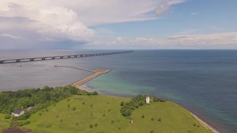 Drone Elevation Revealing Knudshoved Lighthouse, Great Belt Bridge and Eastern Stock Footage 346747230