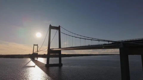 Drone Elevation Revealing the New Little Belt Bridge with Golden Sea Stock Footage 346269972