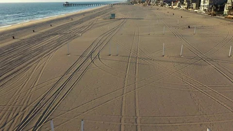 Drone of empty Manhattan Beach volleyball nets during Corona Virus Video stock 127610227