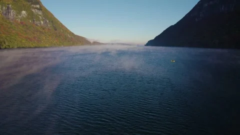Drone Epic Wide Circling Man Paddling Kayak Lake Vermont Fog Covered Stock Footage 255752693