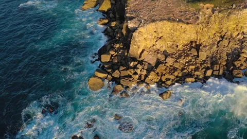 Drone establishing shot of ocean waves break on rocky island shores, Portugal Stock Footage 258820971