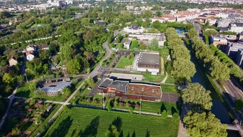 Drone establishing shot over Parc du Heyritz and Ill River in Strasbourg 動画素材 339057840