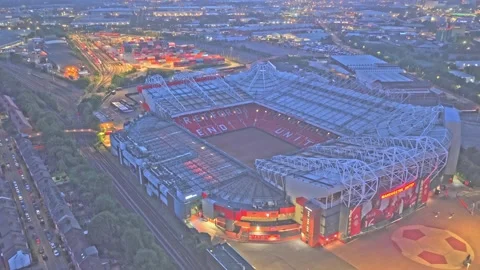 Drone establishing shot with parallax of Old Trafford at blue hour in Greater Vidéo 341184875