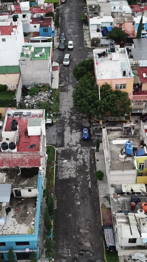 Drone explores Ecatepec’s bumpy paths, vertical mode Stock Footage 293771342