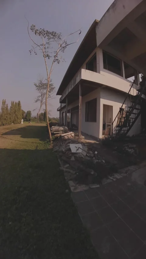 Drone Explores Thailand's Rice Fields and an Abandoned House Stock Footage 305460331