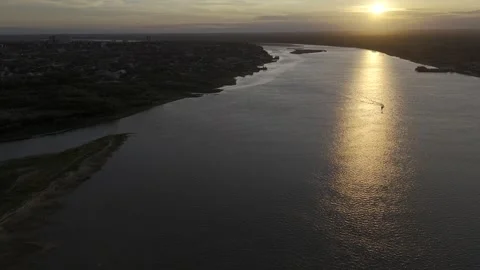 Drone, facing the sunset, flies to the left over the Paraguay River Stock Footage 294080799