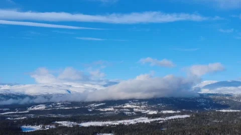 Drone fast flight over winter mountain valley Norway 4K Video stock 328994872