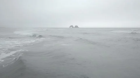 Drone fast push in above ocean toward arch rock formation off Portland coast Vídeos de archivo 167675084