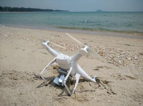 Drone fell on the beach Stock Photos