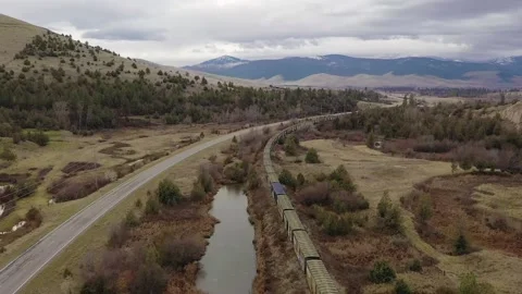 Drone field mountains and train Stock Footage 152543192