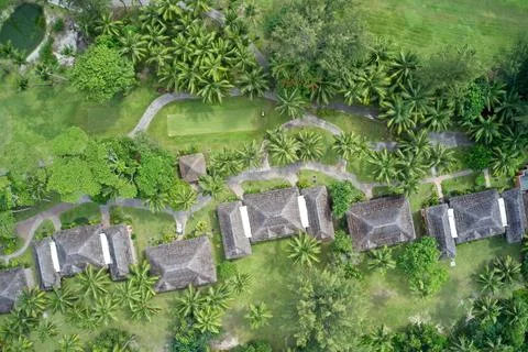 Drone field of view of chalets hidden among forest in Praslin, Seychelles. Stock Photos
