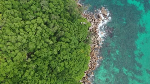 Drone field of view of turquoise blue waters following coastline Stock Footage 153250953