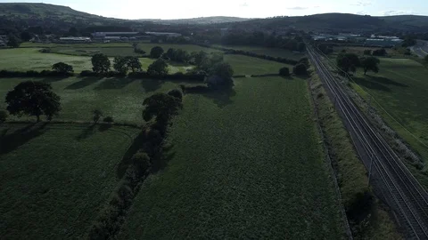 Drone of fields and trees with sun casting long shadows Stock-Footage 95326843