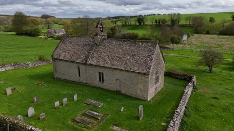 Drone fight over ancient 13th Century Cotswold church, 4K, Oxfordshire. Stock Footage 272604603