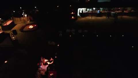 Drone filming a dancer with fire at night on an Arabian carpet Stock Footage 256204596
