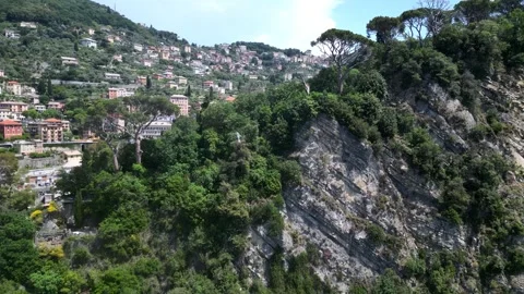 Drone filming by flying parallel a cliff in Camogli, Liguria Stock Footage 242958426
