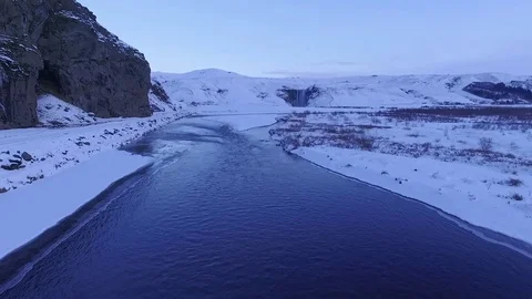 Drone filming over river towards water fall in Iceland Stock Footage 82875593