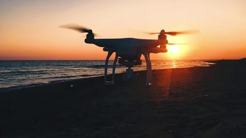Drone filming sunset on the beach Stock Footage 79589414