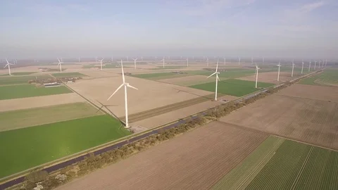 Drone filming windmills in fields in Flevoland Video stock 75351295