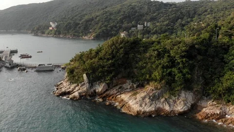 A drone flew over a rock on which waves are breaking Stock Footage 119617595
