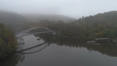 Drone flies above bridge next to Veveri castle in Czech Republic. Morning fog. Stock Footage 142072373